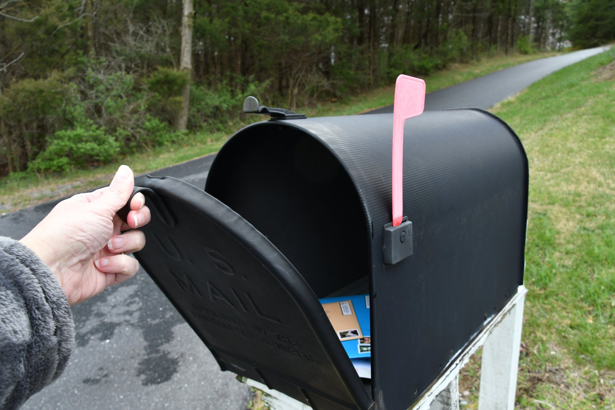 mailing-a-small-package-and-envelopes-with-cards-2025-03-11-18-26-47-utc