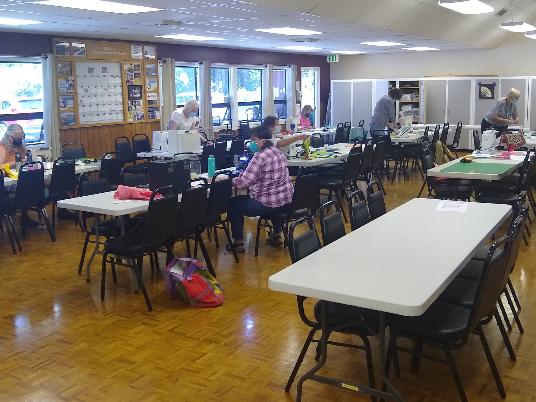 Community members gathered at activity tables